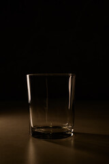 Elegant glass sitting in soft light casting gentle shadows