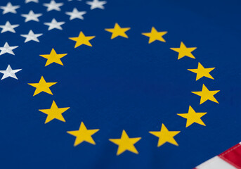 An artistic shot featuring the flags of the European Union and the United States of America together.