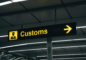 Customs sign directing travelers in the airport, a guide for international arrivals.