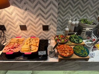 Breakfast Buffet with Assorted Cold Dishes and Western-Style Bites
