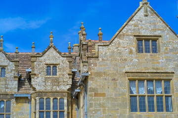UK, Haywards Heath, 12.4.2025: A captivating view of Wakehurst Estate, with its historic architecture set against the backdrop of lush greenery. 