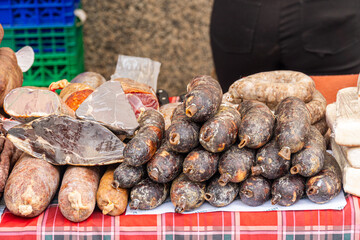 Selection of sausages and salted meats at a street market