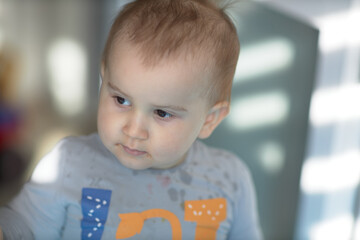 Toddler boy posing indoors