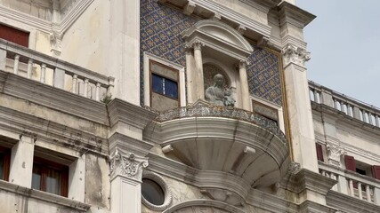Venice, Italy - 2024 April 17: This video shows a wide view of Piazza San Marco in Venice, Italy. The square is crowded with tourists. The video was taken on a sunny day.