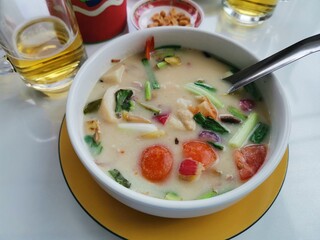 Delicious Tom Yum Soup Served in a White Bowl