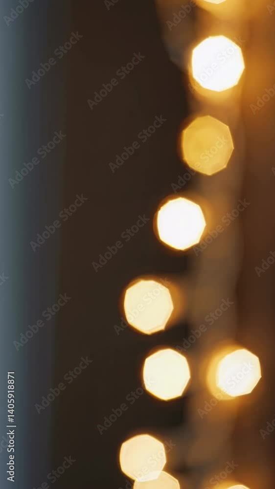 Poster abstract video style with a vertical angle capturing soft-focus bokeh lights against a dark backgrou