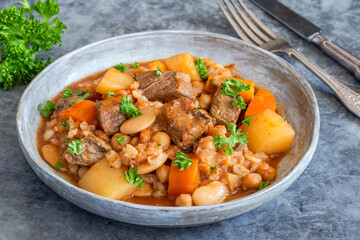 Cholent - traditional slow cooked Jewish stew of beef brisket, butter beans, chickpeas, pearl barley and root vegetables