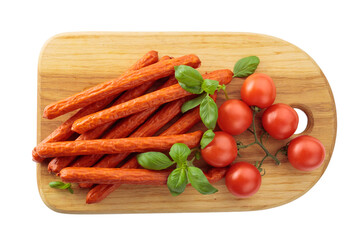 Kabanos sausages with basil and tomatoes isolated on a white background.