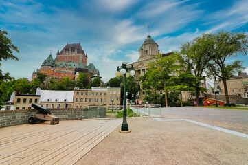 Fototapeta premium Spectacular views of the iconic Hotel Chateau Fairmont on Quebec hill with the Louis S St.Laurent Building as seen from the Montmorency park in Quebec city,Canada