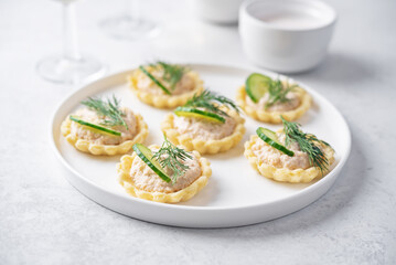 Salmon mousse tartlets in a plate