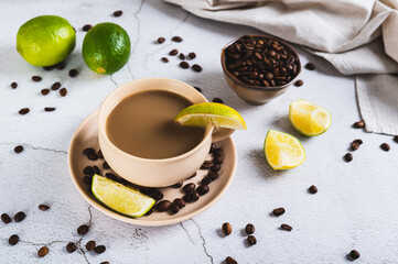 A cup of latte infused with lime on the table