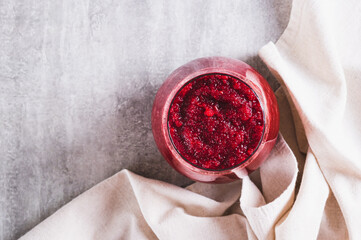 Close up of ABC juice from beetroot, carrot and apple for detox in a glass on the table top view