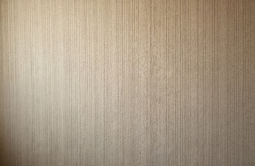 Vertical textured beige background. Rough fabric material with retro style. Natural fibers, minimalist design. Neutral warm colors. Hemp canvas textile pattern. Use as surface or wallpaper.