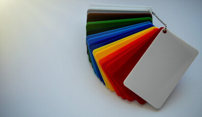 Colored impact-resistant polystyrene. Color-coded plastic layout for material selection.