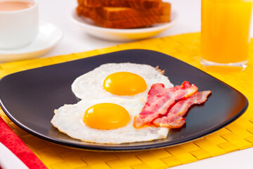Nutritious breakfasts. Fried eggs with bacon.