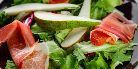 Salad pear ham vegetable dish fresh tasty gourmet food background on the table rustic food top view copy space