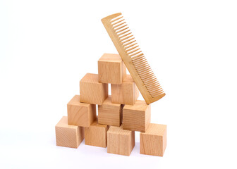 Obraz premium classic wooden comb on a white background
