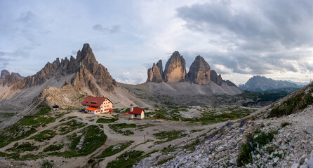 Famous mountain range Tre Cime di Lavaredo with mountain hut