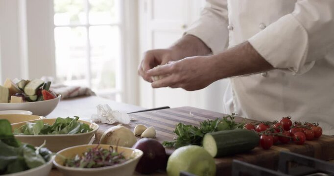 Food, vegetables and closeup of chef hands in kitchen with ingredients for cooking meal, dinner or lunch at home. Diet, wellness and zoom of produce groceries for salad on counter at modern house.