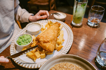 Traditional Fish And Chips Served With Mushy Peas