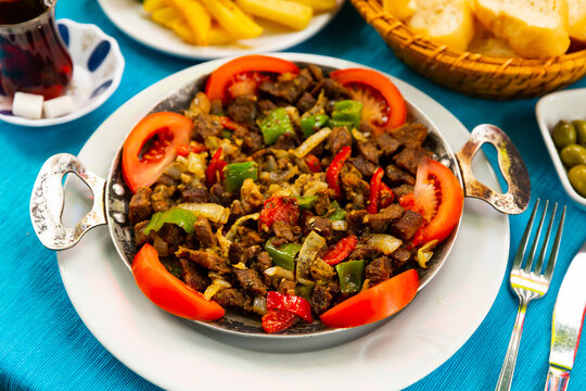 A frying pan with a national Turkish meat dish called Sach Kavurma (Sac Kavurma).....