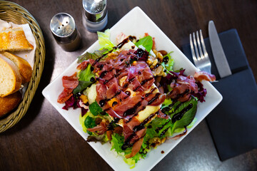 Typical appetizing spanish goat cheese salad. High quality photo