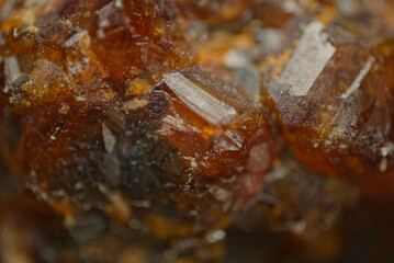 Garnet (andradite, hessanite) crystals. Sinyaya Rechka deposit, Far East, Russia. High magnification microphotograph- photo scale 10X.