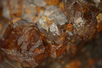 Garnet (andradite, hessanite) crystals. Sinyaya Rechka deposit, Far East, Russia. High magnification microphotograph- photo scale 10X.