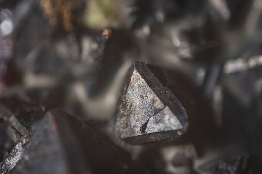 Mineral Cuprite (red copper ore) and silver crystals. Microphotography with high magnification- photo scale 10X