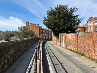 Town Wall road and footpath alongside brick and stone structures in Shrwewsbury