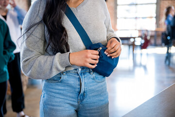 young woman with crossbody purse