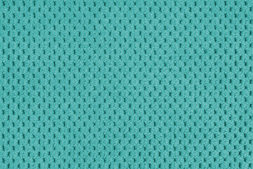 Plain turquoise velour upholstery fabric, fleecy jacquard with macro, closr up pattern weave texture background, cloth textile surface. Wallpaper, backdrop with copy space
