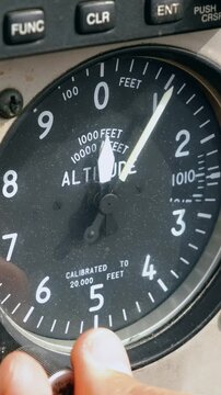 The pilot sets the pressure settings QNH on the altimeter instrument in the cockpit of the aircraft. Concept of reliability of aviation instruments