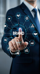 Brand Building: Man touching virtual screen with brand management icons. Grow your business, strategy, and success with powerful branding!