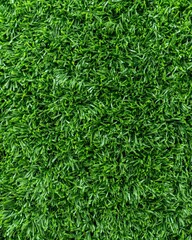 Synthetic turf football field top view, fresh green surface with modern layout