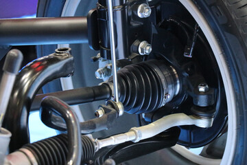 Fototapeta premium Drive system in electric cars. electric system of car front driving axle in the car. elements of the steering system