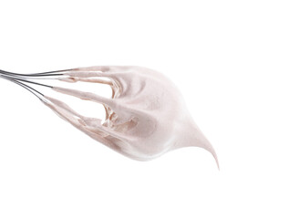 Whisk with delicious cream isolated on white