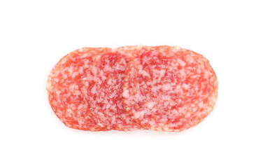 Slices of tasty smoked sausage on white background, top view