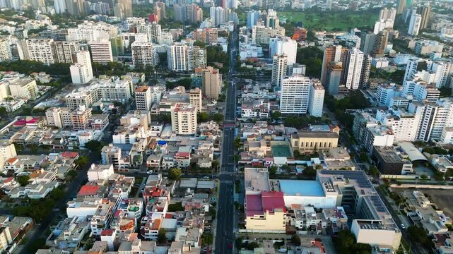 Quiet avenue in the heart of San Isidro, Lima, bathed in the soft light of an autumn afternoon.