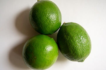 closeup fresh green lemon on a white background