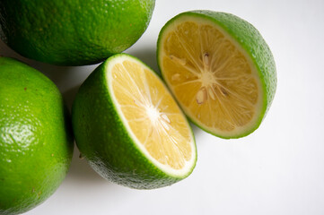 closeup fresh green lemon on a white background