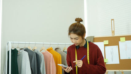 Entrepreneur fashion designer in textile business designing garment retail clothing collection....