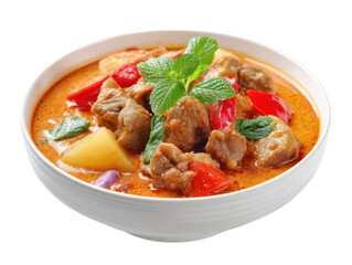 vibrant bowl of Massaman curry rich in color and flavor, garnished with fresh mint
