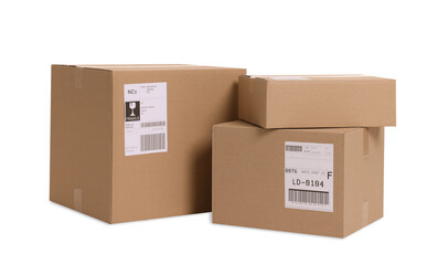 Many parcels with shipment labels isolated on white