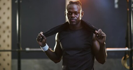Workout, towel and black man serious for gym commitment, training exercise or sports club routine. Fitness bodybuilder, portrait and African athlete determined muscle building, challenge or hard work
