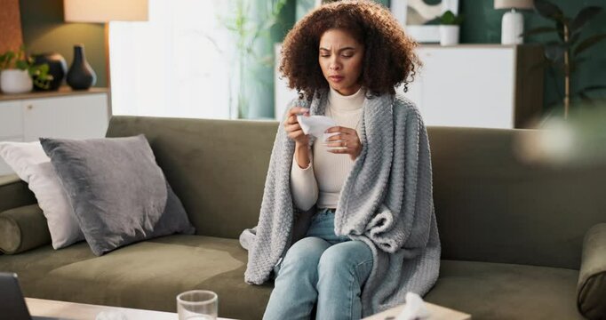 Blanket, sick and woman with tissue on sofa for respiratory virus, flu and infection at home. Female person, allergies and problem with nose in living room for sinusitis, bacteria or fatigue on couch