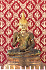 Fototapeta premium BANGKOK, THAILAND: April 14, 2025 - The Colorful Buddha Statue located inside the Buddhist temples in Bangkok, Thailand. Concept for those who have faith to come to pay respect.