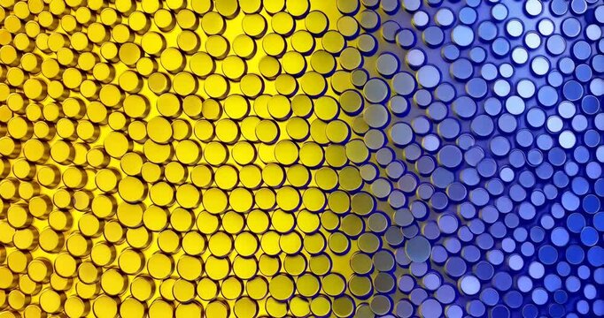 Colorful sequins transitioning from yellow to blue in dynamic pattern shift