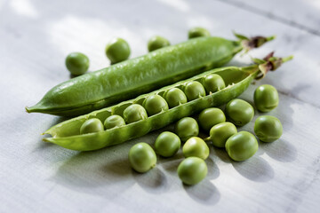 Fresh Green Peas In Pods On A White Wooden Background Healthy Food