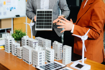 Professionals for a greener future. Showcasing renewable energy solutions with solar panels, wind...